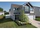 Charming two-story home featuring a two car garage, manicured landscaping, and mature trees at 3322 Brighton Dr, Gastonia, NC 28052