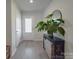 Foyer featuring hardwood floors, a storage closet, white doors, and console table at 3322 Brighton Dr, Gastonia, NC 28052