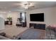 Comfortable living room with large tv, adjacent to a gaming desk and dining room at 3322 Brighton Dr, Gastonia, NC 28052
