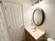 Bathroom featuring a vanity with decorative mirror and a door to a linen closet at 3602 Melrose Cottage Dr, Matthews, NC 28105