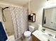 Functional bathroom with a shower/tub combo, framed mirror, and convenient shelving for storage at 3602 Melrose Cottage Dr, Matthews, NC 28105