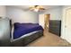 Bedroom with built-in storage bed, ceiling fan, and dresser, providing ample storage space at 3602 Melrose Cottage Dr, Matthews, NC 28105