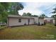 Well-maintained backyard with lush lawn and partial fencing at 3623 Braden Dr, Charlotte, NC 28216