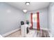 Charming bedroom featuring a modern desk, sleek monitor, and abundant natural light at 3623 Braden Dr, Charlotte, NC 28216