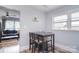 Dining area next to living room offers a dark wood dining set, perfect for gatherings at 3623 Braden Dr, Charlotte, NC 28216