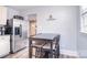 Cozy dining area features a stainless steel refrigerator and black dining set at 3623 Braden Dr, Charlotte, NC 28216