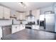 Modern kitchen with stainless steel appliances, white cabinetry and subway tile backsplash at 3623 Braden Dr, Charlotte, NC 28216
