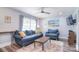 Bright living room with a large window and a ceiling fan at 3623 Braden Dr, Charlotte, NC 28216