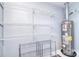 Well-organized storage room with wire shelving and a modern water heater at 3623 Braden Dr, Charlotte, NC 28216