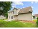 Tan home features a concrete patio, well-maintained lawn, and a tidy, inviting exterior at 4004 Shasta Cir, Clover, SC 29710