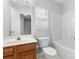 Bathroom featuring warm lighting, wood-look cabinets, with tub and shower at 4004 Shasta Cir, Clover, SC 29710