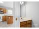 Well-lit bathroom featuring a single sink vanity, wood cabinets, and a neutral color scheme at 4004 Shasta Cir, Clover, SC 29710
