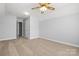 Large bedroom featuring neutral paint and flooring, ceiling fan and access to connecting bathroom at 4004 Shasta Cir, Clover, SC 29710