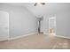 Bright bedroom boasts neutral paint, large window for natural light, and access to an ensuite bathroom at 4004 Shasta Cir, Clover, SC 29710
