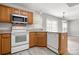 Efficiently designed kitchen with light wood cabinets and ample counter space at 4004 Shasta Cir, Clover, SC 29710