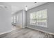Bright living room with new flooring and modern light fixture at 4004 Shasta Cir, Clover, SC 29710