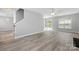 Open-concept living room showcasing abundant natural light and seamless flow into other living spaces at 4004 Shasta Cir, Clover, SC 29710