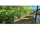 Private backyard setting with a wooden deck overlooking wooded surroundings, offering a serene escape at 401 Pamela St, Gastonia, NC 28054