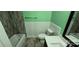 A full bathroom with tile floor, tub, toilet, and vanity at 401 Pamela St, Gastonia, NC 28054