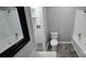 Fresh bathroom boasts a shower, bathtub, modern toilet, and a decorative vanity mirror at 401 Pamela St, Gastonia, NC 28054