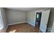 Spacious bedroom with hardwood floors and natural light, ready for personal touches and décor at 401 Pamela St, Gastonia, NC 28054