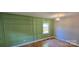 Bedroom with wainscoting, hardwood floors and a window at 401 Pamela St, Gastonia, NC 28054