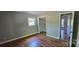 Bedroom features an open closet with hardwood floors and a window at 401 Pamela St, Gastonia, NC 28054