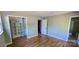 Bedroom featuring hardwood floors, closet with shelving and a door leading to the bathroom at 401 Pamela St, Gastonia, NC 28054