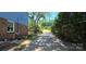 Long driveway leading to a charming home, lined with lush greenery at 401 Pamela St, Gastonia, NC 28054