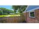 Charming brick home with a fenced yard and mature trees providing shade and curb appeal at 401 Pamela St, Gastonia, NC 28054