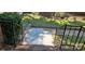 Front porch, featuring a black iron railing and brick steps at 401 Pamela St, Gastonia, NC 28054