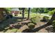Landscaped front yard with mature trees and shrubs, creating a serene and inviting atmosphere at 401 Pamela St, Gastonia, NC 28054