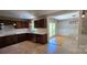 Charming kitchen featuring tile floors, dark cabinets, stainless steel appliances and bright quartz countertops at 401 Pamela St, Gastonia, NC 28054