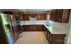 Renovated kitchen features stainless steel appliances, quartz countertops, and plenty of storage at 401 Pamela St, Gastonia, NC 28054
