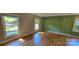 Bright living room with hardwood floors and a modern accent wall at 401 Pamela St, Gastonia, NC 28054