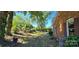 A serene side yard featuring mature trees, lush green grass, and well-maintained landscaping at 401 Pamela St, Gastonia, NC 28054