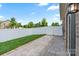 The backyard has a paver patio area, grass, and is surrounded by a white vinyl fence at 4028 Woodsmill Rd, Fort Mill, SC 29707