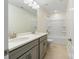 Bright bathroom featuring double sink vanity with gray cabinets and a tub-shower combination at 4028 Woodsmill Rd, Fort Mill, SC 29707