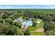 Aerial view of a community pool, clubhouse, tennis courts, and lush landscaping at 4028 Woodsmill Rd, Fort Mill, SC 29707