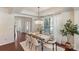 Dining room with neutral tones, hardwood floors, and a view of the home's front entrance at 4028 Woodsmill Rd, Fort Mill, SC 29707