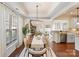 Formal dining room with decorative chandelier and sightlines to the kitchen and living room at 4028 Woodsmill Rd, Fort Mill, SC 29707