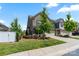 Charming two-story home with manicured lawn, attached garage, and neutral brick facade at 4028 Woodsmill Rd, Fort Mill, SC 29707