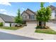 Beautiful two-story home with a brick facade, attached garage and a well-manicured front yard at 4028 Woodsmill Rd, Fort Mill, SC 29707