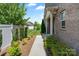 A landscaped yard, stone walkway and brick exterior offer great curb appeal at 4028 Woodsmill Rd, Fort Mill, SC 29707