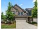 Charming two-story brick home with a well-manicured lawn and attached two-car garage at 4028 Woodsmill Rd, Fort Mill, SC 29707