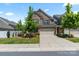 Charming two-story brick home with manicured lawn and attached two-car garage at 4028 Woodsmill Rd, Fort Mill, SC 29707