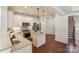 Bright kitchen with stainless appliances, central island, and hardwood floors at 4028 Woodsmill Rd, Fort Mill, SC 29707