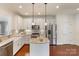 Modern kitchen with stainless steel appliances, granite countertops, and a stylish island at 4028 Woodsmill Rd, Fort Mill, SC 29707
