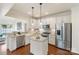 Well-lit kitchen with stainless steel appliances and a center island with granite countertops at 4028 Woodsmill Rd, Fort Mill, SC 29707