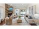Cozy living room features a stone fireplace, neutral tones, and large sliding glass doors at 4028 Woodsmill Rd, Fort Mill, SC 29707